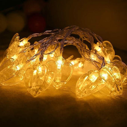 Heart-shaped string lights on a dark background